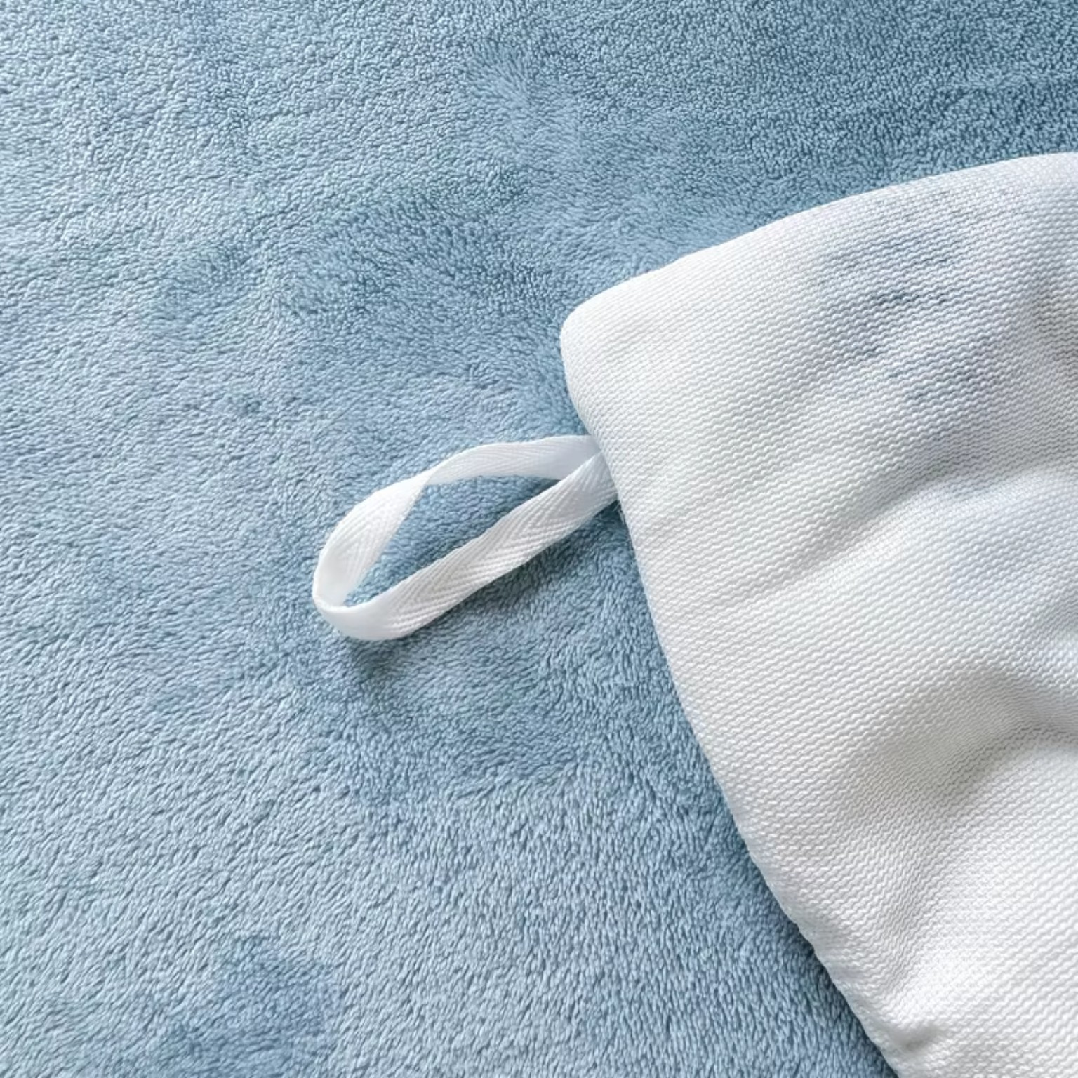 Soft blue fleece bedding detail